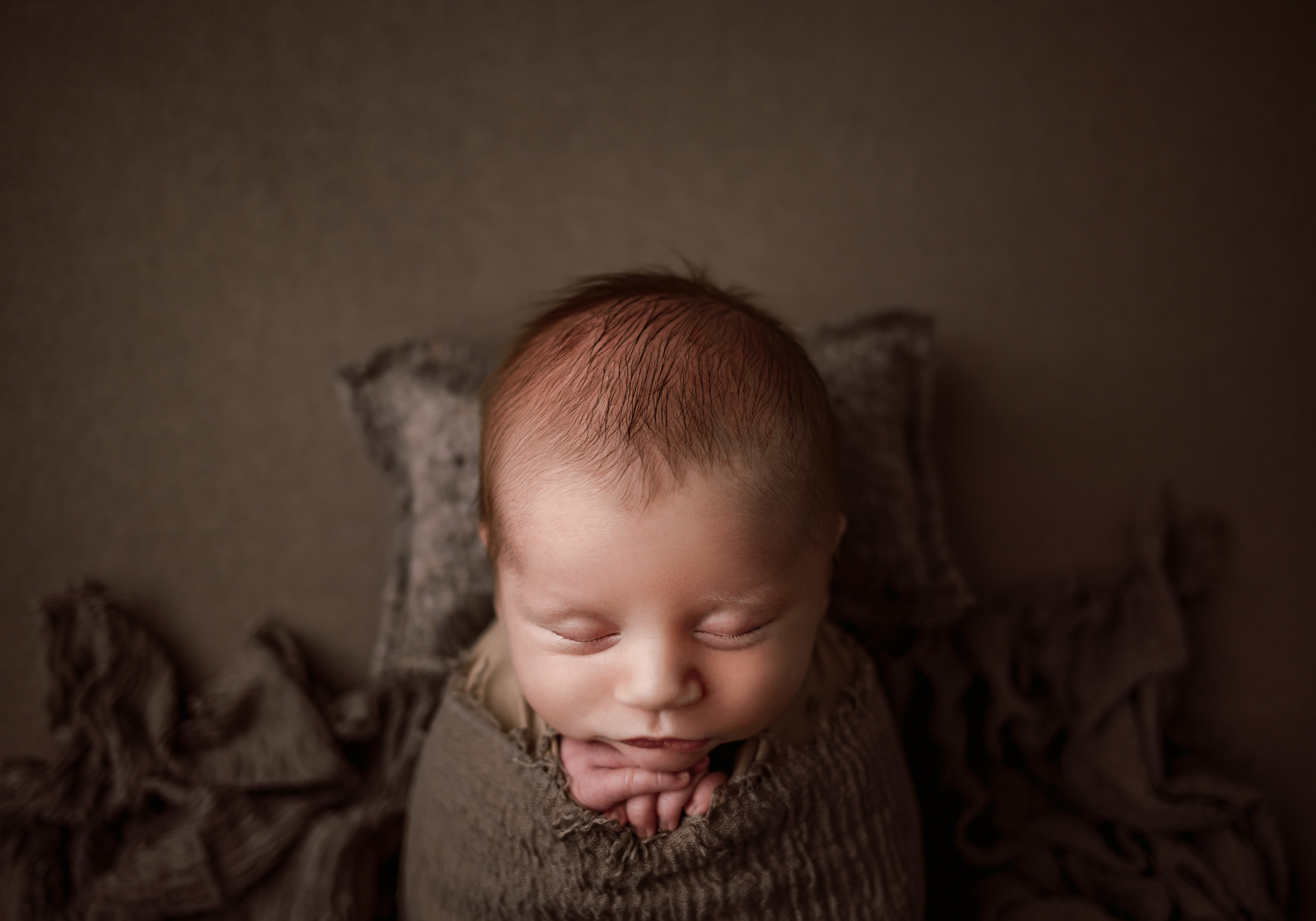 newborn baby boy on newborn photoshoot props